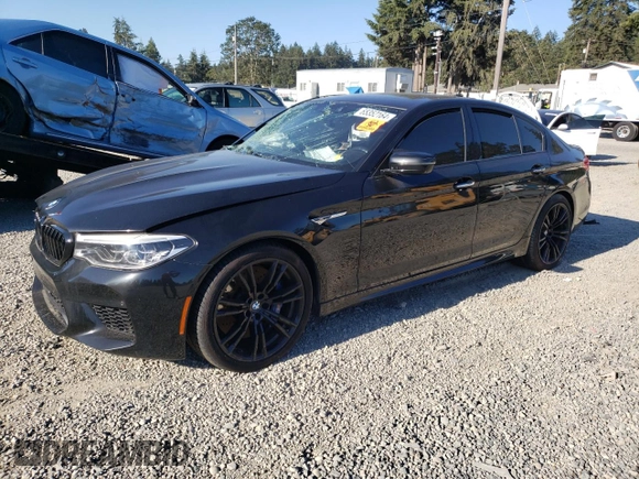 2018 BMW M5 z VIN WBSJF0C57JB283361, wystawiony jako Copart lot #65352164 z przebiegiem Nie podano mil oraz Szkoda całkowita • Salvage title. Historia ofert i sprzedaży dostępna na DreamBid. Obrazek 1.
