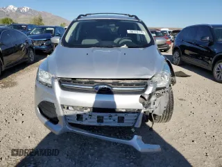 2013 Ford Escape SE z VIN 1FMCU9G96DUD12621, wystawiony jako Copart lot #56176175 z przebiegiem 85 597 mil mil oraz Szkoda całkowita • Salvage title. Historia ofert i sprzedaży dostępna na DreamBid. Obrazek 5.