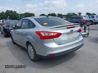 2013 Ford Focus SE with VIN 1FADP3F25DL138117, listed as a IAAI auction lot 42162119 with 136,979 mi miles. Bid and sale history available at carsss.com. Image 3.