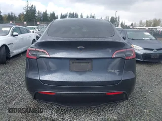 2023 Tesla Model Y Long Range with VIN 7SAYGAEE4PF871281, listed as a IAAI auction lot 41989805 with 15,501 mi miles. Bid and sale history available at carsss.com. Image 17.