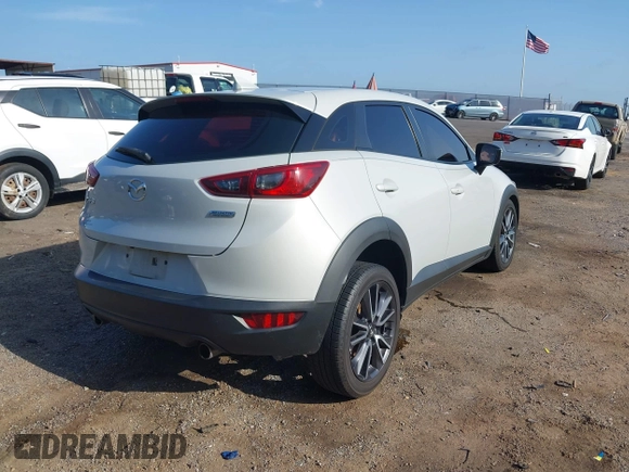 2018 Mazda CX-3 Touring with VIN JM1DKDC73J0319938, listed as a IAAI auction lot 39861564 with 117,199 mi miles. Bid and sale history available at carsss.com. Image 4.