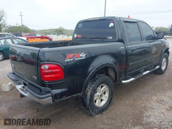2002 Ford F-150 XLT with VIN 1FTRW08L72KD27457, listed as a IAAI auction lot 41993148 with 372,589 mi miles. Bid and sale history available at carsss.com. Image 4.
