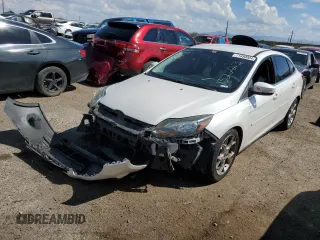 2014 Ford Focus Titanium with VIN 1FADP3J26EL132223, listed as a Copart auction lot 71490004 with 131,233 mi miles and Salvage Title. Bid and sale history available at DreamBid. Image 1.