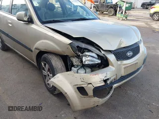 2009 Kia Rio SX with VIN KNADE223196512461, listed as a IAAI auction lot 41520063 with 132,558 mi miles. Bid and sale history available at carsss.com. Image 6.