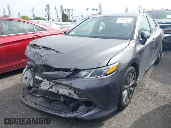 2019 Toyota Camry LE with VIN 4T1B11HK4KU254853, listed as a IAAI auction lot 42013255 with 153,664 mi miles and . Bid and sale history available at DreamBid. Image 22.