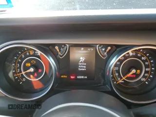 2022 Jeep Wrangler Unlimited Sport with VIN 1C4HJXDG4NW206622, listed as a Copart auction lot 47971005 with 62,240 mi miles and Salvage Title. Bid and sale history available at DreamBid. Image 9.