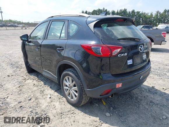 2014 Mazda CX-5 Sport with VIN JM3KE2BE3E0405976, listed as a IAAI auction lot 42161069 with 66,301 mi miles and . Bid and sale history available at carsss.com. Image 3.