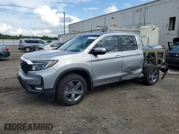 2023 Honda Ridgeline RTL-E with VIN 5FPYK3F70PB018858, listed as a Copart auction lot 64210205 with 16,562 mi miles and Salvage title. Bid and sale history available at DreamBid. Image 1.