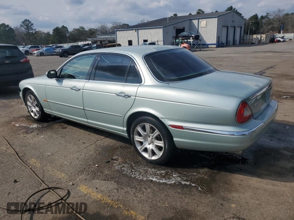 2004 Jaguar XJ with VIN SAJWA71C94SG24466, listed as a Copart auction lot 46610995 with 173,570 mi miles and Salvage Title. Bid and sale history available at carsss.com. Image 2.
