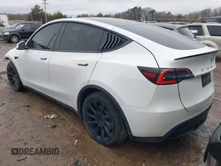 2021 Tesla Model Y Standard Range with VIN 5YJYGDED8MF114076, listed as a IAAI auction lot 41567295 with 150,133 mi miles and . Bid and sale history available at DreamBid. Image 3.