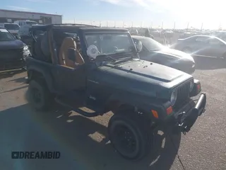1997 Jeep Wrangler SE with VIN 1J4FY29PXVP409498, listed as a IAAI auction lot 41818698 with 150,086 mi miles. Bid and sale history available at carsss.com. Image 1.