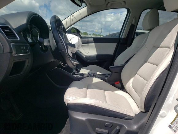 2016 Mazda CX-5 Grand Touring with VIN JM3KE4DY6G0857197, listed as a Copart auction lot 44500955 with 76,088 mi miles and Salvage Title. Bid and sale history available at DreamBid. Image 7.