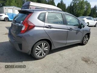 2015 Honda Fit EX-L with VIN 3HGGK5H80FM767970, listed as a Copart auction lot 55866075 with 64,435 mi miles and Salvage Title. Bid and sale history available at DreamBid. Image 3.