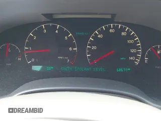 2004 Cadillac DeVille DHS z VIN 1G6KE54Y64U110060, wystawiony jako IAAI lot #42133610 z przebiegiem 68 677 mil mil oraz . Historia ofert i sprzedaży dostępna na DreamBid. Obrazek 7.