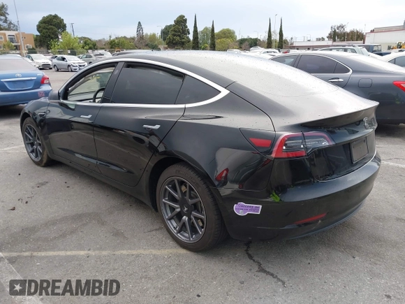2019 Tesla Model 3 Mid Range with VIN 5YJ3E1EA6KF361808, listed as a IAAI auction lot 41767241 with 96,200 mi miles and . Bid and sale history available at carsss.com. Image 3.