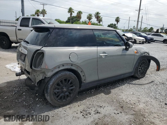 2014 MINI Hardtop with VIN WMWXM5C51ET934047, listed as a Copart auction lot 63039335 with 104,446 mi miles and Salvage title. Bid and sale history available at DreamBid. Image 3.