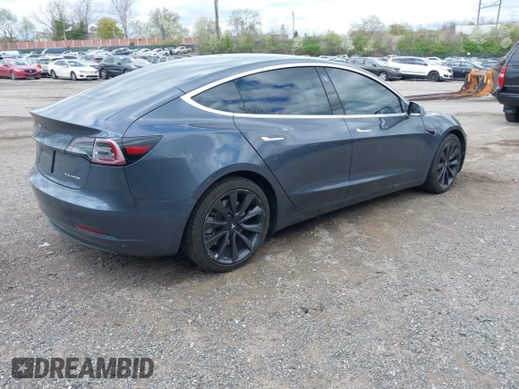 2020 Tesla Model 3 Long Range with VIN 5YJ3E1EB2LF646449, listed as a IAAI auction lot 42059086 with 120,981 mi miles and . Bid and sale history available at DreamBid. Image 4.