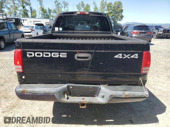 2001 Dodge Dakota Sport z VIN 1B7GG2AN81S113605, wystawiony jako Copart lot #58990065 z przebiegiem 243 919 mil mil oraz Czysty tytuł • Clean title. Historia ofert i sprzedaży dostępna na DreamBid. Obrazek 6.