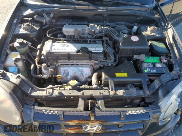 2005 Hyundai Accent GLS z VIN KMHCG45C15U662362, wystawiony jako Copart lot #80574774 z przebiegiem 122 898 mil mil oraz Szkoda całkowita • Salvage title. Historia ofert i sprzedaży dostępna na DreamBid. Obrazek 13.