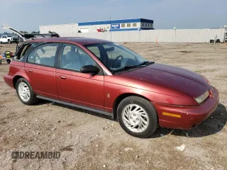 1999 Saturn SW z VIN 1G8ZK827XXZ348270, wystawiony jako Copart lot #67872244 z przebiegiem 110 936 mil mil oraz Szkody całkowita. Historia ofert i sprzedaży dostępna na DreamBid. Obrazek 4.