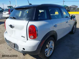 2013 MINI Cooper Countryman with VIN WMWZB3C51DWM31277, listed as a IAAI auction lot 41506486 with 79,006 mi miles. Bid and sale history available at carsss.com. Image 4.