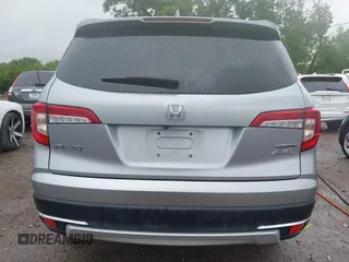 2019 Honda Pilot Touring 8-Passenger with VIN 5FNYF6H98KB097105, listed as a IAAI auction lot 42353009 with 133,212 mi miles and . Bid and sale history available at DreamBid. Image 16.