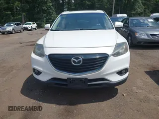 2014 Mazda CX-9 Touring z VIN JM3TB3CV7E0426900, wystawiony jako IAAI lot #42796725 z przebiegiem Nie podano mil oraz . Historia ofert i sprzedaży dostępna na DreamBid. Obrazek 12.