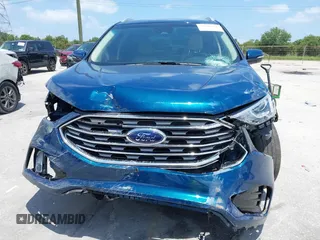 2020 Ford Edge SEL z VIN 2FMPK3J94LBB45306, wystawiony jako IAAI lot #39398218 z przebiegiem 59 807 mil mil oraz . Historia ofert i sprzedaży dostępna na DreamBid. Obrazek 13.