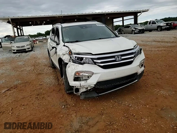 2017 Honda Pilot Touring z VIN 5FNYF6H92HB067140, wystawiony jako Copart lot #55757925 z przebiegiem 132 425 mil mil oraz Szkoda całkowita • Salvage title. Historia ofert i sprzedaży dostępna na DreamBid. Obrazek 14.