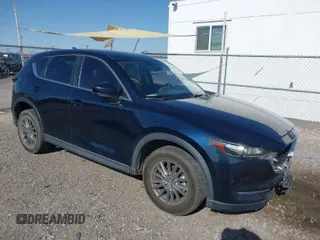 2017 Mazda CX-5 Touring with VIN JM3KFACL5H0180243, listed as a IAAI auction lot 41990818 with 158,977 mi miles. Bid and sale history available at carsss.com. Image 1.