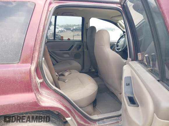 2003 Jeep Grand Cherokee Laredo with VIN 1J4GX48S83C576892, listed as a IAAI auction lot 42082865 with 212,157 mi miles. Bid and sale history available at carsss.com. Image 8.