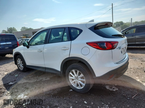 2016 Mazda CX-5 Sport with VIN JM3KE4BYXG0704194, listed as a Copart auction lot 62095735 with 93,970 mi miles and Salvage title. Bid and sale history available at DreamBid. Image 2.