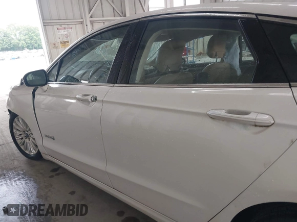 2013 Ford Fusion SE Hybrid with VIN 3FA6P0LU8DR357054, listed as a IAAI auction lot 42372168 with 143,979 mi miles and . Bid and sale history available at DreamBid. Image 14.