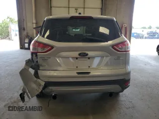 2013 Ford Escape SE with VIN 1FMCU0GXXDUB10035, listed as a Copart auction lot 56817785 with 130,497 mi miles and Salvage title. Bid and sale history available at DreamBid. Image 6.