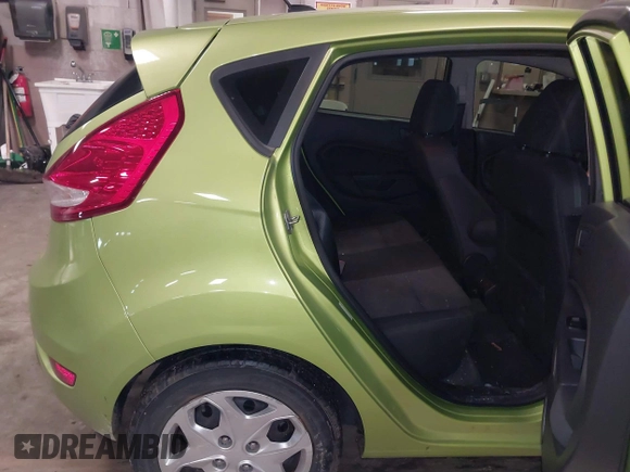 2013 Ford Fiesta SE with VIN 3FADP4EJ9DM131913, listed as a IAAI auction lot 41677333 with 54,673 mi miles. Bid and sale history available at carsss.com. Image 8.