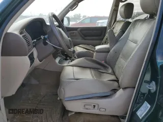 1999 Toyota Land Cruiser with VIN JT3HT05J9X0027448, listed as a Copart auction lot 77175814 with 0 mi miles and Salvage Title. Bid and sale history available at carsss.com. Image 7.