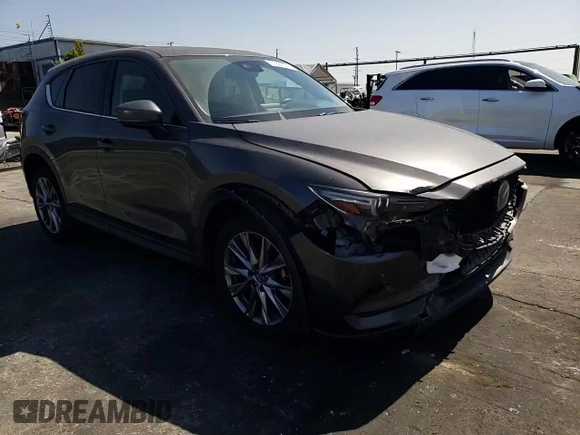 2019 Mazda CX-5 Grand Touring with VIN JM3KFADM6K1641992, listed as a Copart auction lot 57862345 with 37,100 mi miles and Salvage title. Bid and sale history available at DreamBid. Image 14.