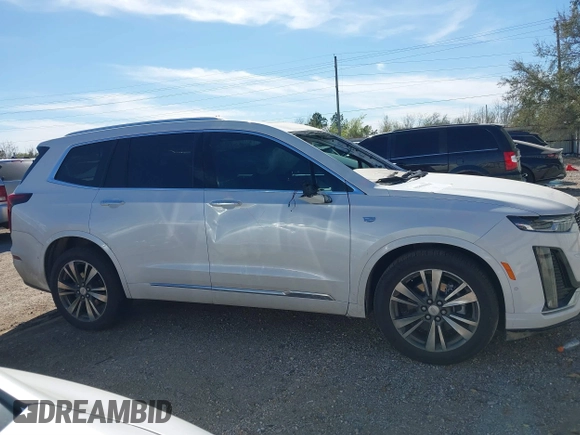 2021 Cadillac XT6 Premium Luxury z VIN 1GYKPCRS6MZ230499, wystawiony jako IAAI lot #41808404 z przebiegiem 86 933 mil mil oraz . Historia ofert i sprzedaży dostępna na DreamBid. Obrazek 14.