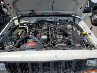 1998 Jeep Cherokee Sport with VIN 1J4FJ68S1WL259582, listed as a Copart auction lot 68115624 with 235,380 mi miles and Salvage Title. Bid and sale history available at carsss.com. Image 12.