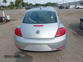 2012 Volkswagen Beetle 2.5L with VIN 3VWJX7AT9CM608065, listed as a IAAI auction lot 41864342 with 77,038 mi miles. Bid and sale history available at carsss.com. Image 16.