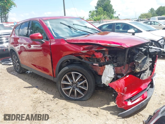 2018 Mazda CX-5 Grand Touring with VIN JM3KFADM4J0335913, listed as a IAAI auction lot 42326044 with 104,583 mi miles and . Bid and sale history available at DreamBid. Image 1.