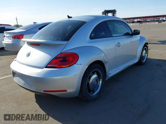 2013 Volkswagen Beetle 2.5L w/Sun/Sound/Nav with VIN 3VWJX7AT5DM606119, listed as a IAAI auction lot 41970253 with 81,004 mi miles and . Bid and sale history available at DreamBid. Image 4.