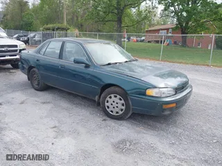 1996 Toyota Camry DX with VIN 4T1BG12K3TU829839, listed as a IAAI auction lot 42085170 with 266,741 mi miles. Bid and sale history available at carsss.com. Image 1.