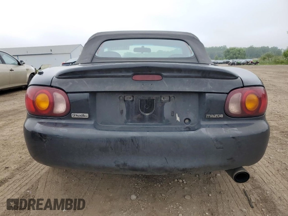 1999 Mazda MX-5 Miata with VIN JM1NB3531X0102616, listed as a Copart auction lot 59779415 with 194,494 mi miles and Salvage title. Bid and sale history available at DreamBid. Image 6.