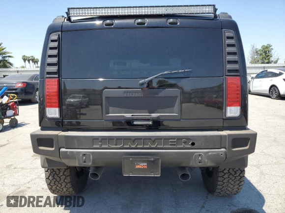 2005 Hummer H2 SUV z VIN 5GRGN23U05H117630, wystawiony jako Copart lot #57087305 z przebiegiem 60 260 mil mil oraz Szkoda całkowita • Salvage title. Historia ofert i sprzedaży dostępna na DreamBid. Obrazek 6.