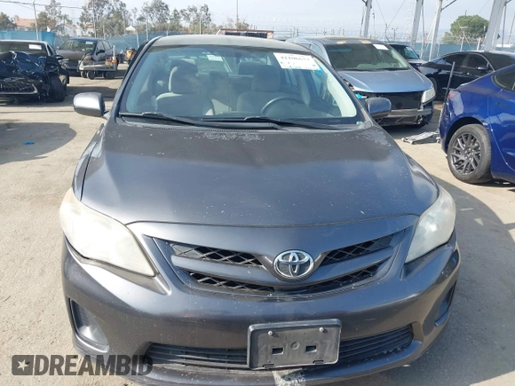 2011 Toyota Corolla L with VIN JTDBU4EE3BJ090749, listed as a IAAI auction lot 42106633 with 209,824 mi miles. Bid and sale history available at carsss.com. Image 13.