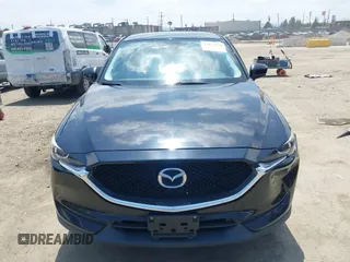 2017 Mazda CX-5 Touring with VIN JM3KFACL0H0124632, listed as a IAAI auction lot 42134971 with 107,029 mi miles and . Bid and sale history available at carsss.com. Image 12.