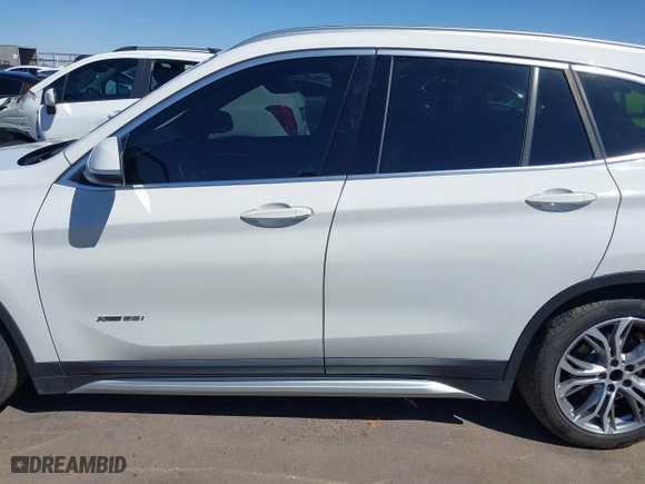 2017 BMW X1 xDrive28i with VIN WBXHT3C30H5F68187, listed as a IAAI auction lot 41830892 with 101,313 mi miles. Bid and sale history available at carsss.com. Image 14.