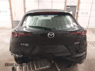 2021 Mazda CX-30 S with VIN 3MVDMBAL2MM265207, listed as a IAAI auction lot 41566325 with 62,587 mi miles and . Bid and sale history available at carsss.com. Image 16.