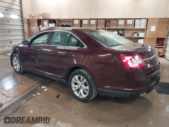 2011 Ford Taurus SEL z VIN 1FAHP2HW5BG141570, wystawiony jako IAAI lot #41867097 z przebiegiem 172 984 mil mil oraz . Historia ofert i sprzedaży dostępna na DreamBid. Obrazek 3.